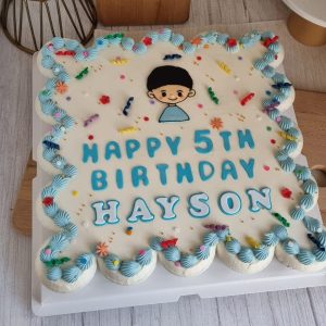 Confetti cupcake cake for boy with blue cream swirls and custom birthday message