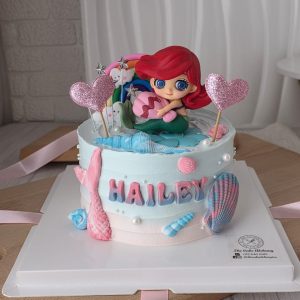 Mermaid princess theme custom birthday cake with Ariel topper, seashell decorations and personalized name in Puchong Selangor by The Cake Alchemy