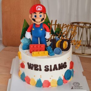 Super Mario theme custom birthday cake with Mario topper, game block decorations and personalized name in Puchong Selangor by The Cake Alchemy