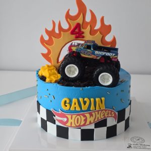 Hot Wheels theme custom birthday cake with monster truck topper, flame design and personalized name in Puchong Selangor by The Cake Alchemy