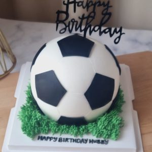 3D soccer ball theme custom birthday cake with realistic football design and grass base in Puchong Selangor by The Cake Alchemy
