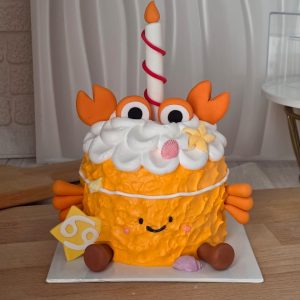 Cancer Horoscope Jellycat Style Birthday Cake with fondant crab claws, textured cream, seashell decorations, candle topper, and Cancer zodiac symbol by The Cake Alchemy Puchong Selangor