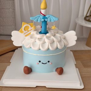 Libra Horoscope Jellycat Style Birthday Cake with pastel blue cream, fluffy cream topping, angel wings, Libra zodiac symbol, candle topper, and cute smiling face by The Cake Alchemy Puchong Selangor