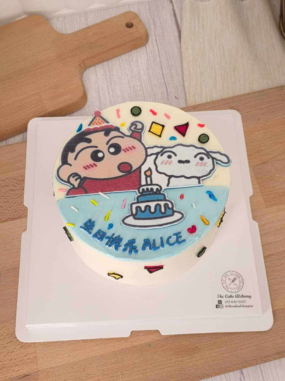 Shin Chan birthday cake with cartoon character design, colorful confetti decorations, birthday cake illustration, and personalized name by The Cake Alchemy in Puchong Selangor Malaysia.