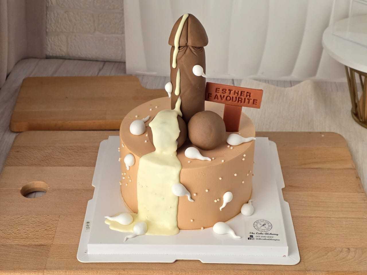Naughty adult birthday cake with cheeky 3D decoration, cream details, and personalized message plaque by The Cake Alchemy
