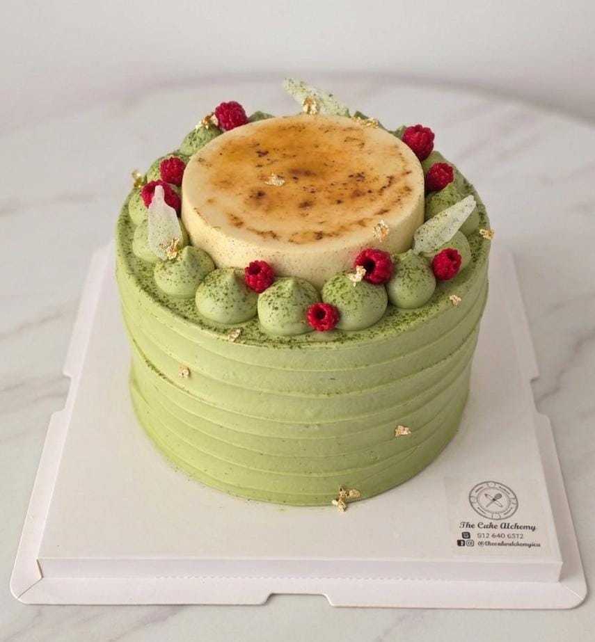 Matcha Brûlée Cake with caramelized brûlée centerpiece, matcha cream, and gold accents by The Cake Alchemy